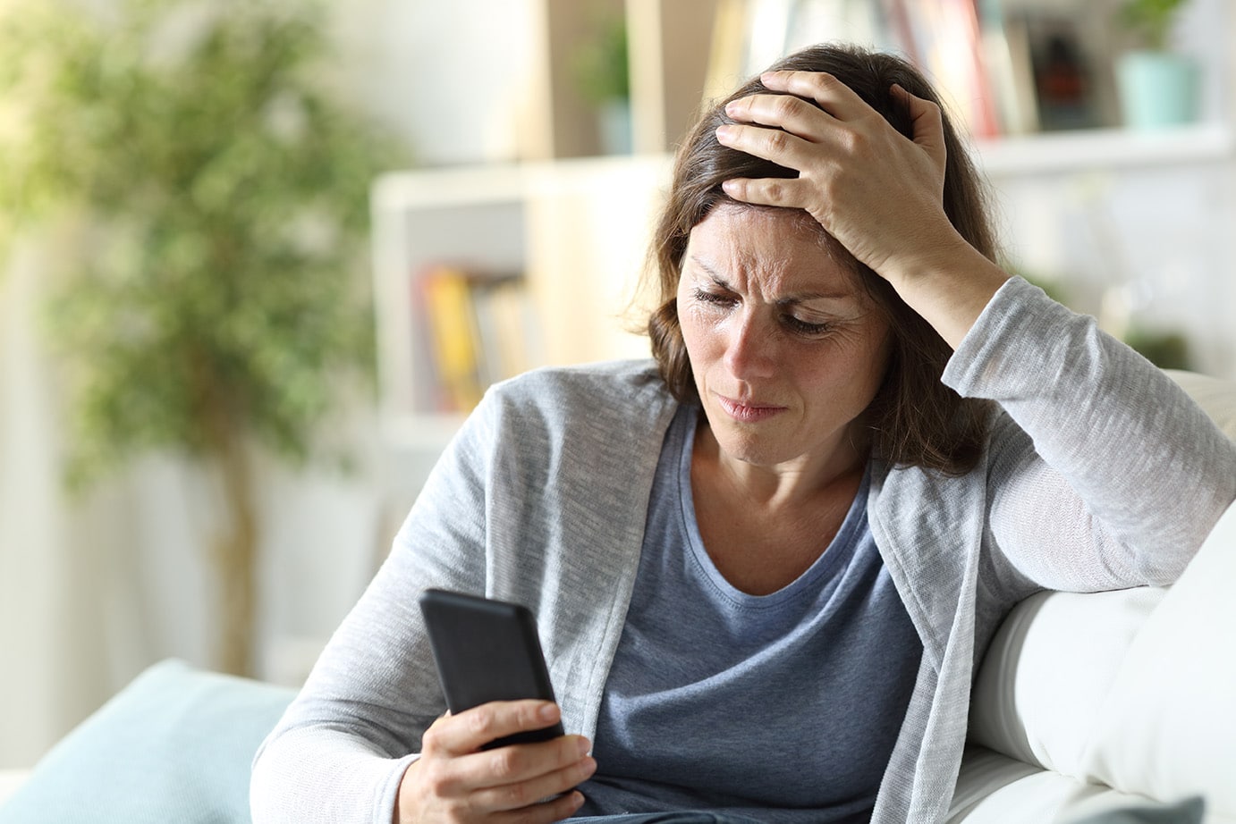 Concerned Woman Looking at Phone
