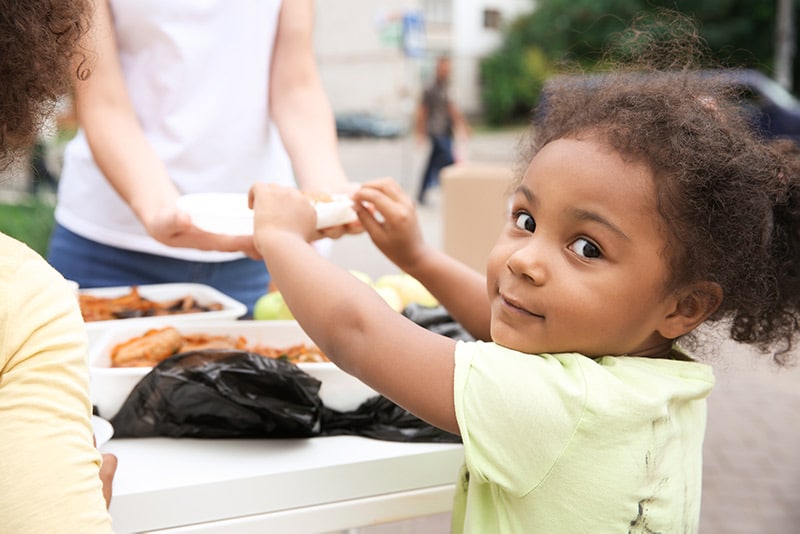 Child receiving food.